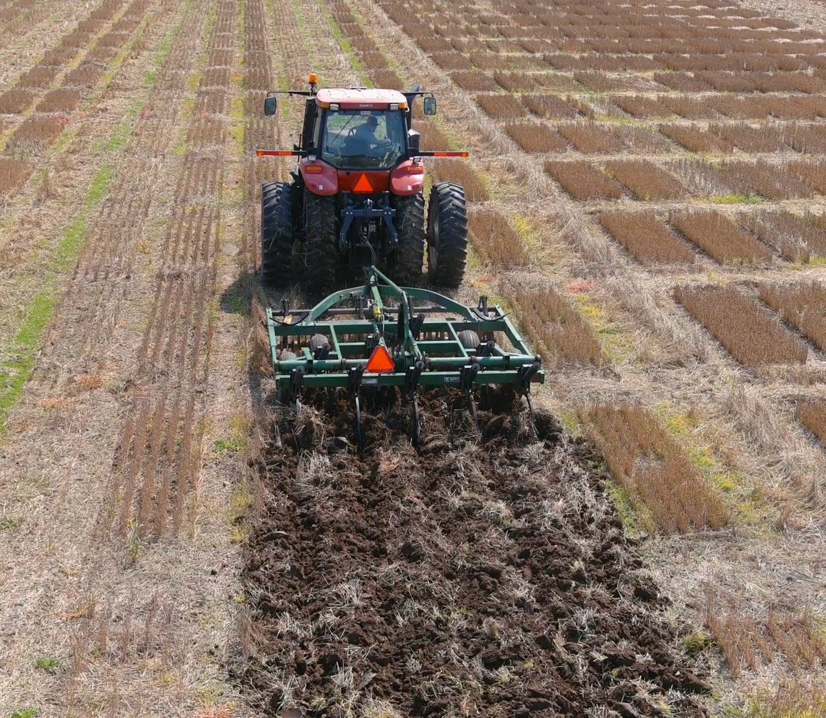 A tillage plow tilling a field.